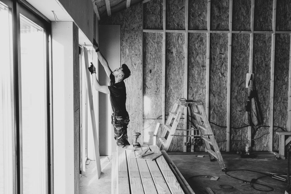 Window installation contractor reviewing plans